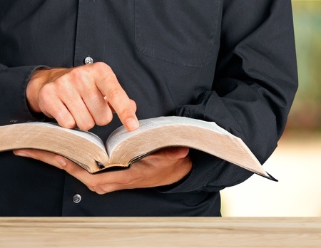 headmaster with bible